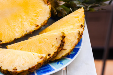 Fresh ripe pineapple slices on the plate