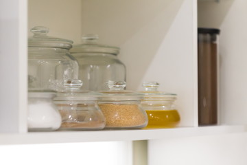 Interior. Jars and and boxes in the kitchen cupboard