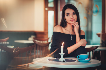 Beautiful woman sitting at the restaurant