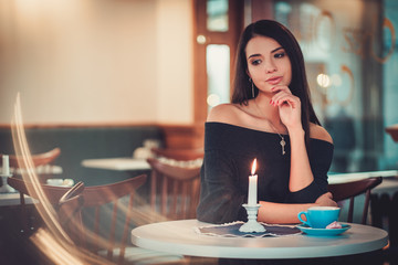 Beautiful woman sitting at the restaurant