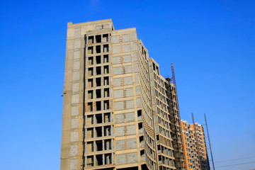 Unfinished buildings in the blue sky