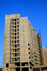 Unfinished buildings in the blue sky