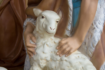 christmas sheep,Christmas statuette hugging a sheep with a shepherd