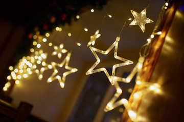 beautiful garland decoration of the new year in the form of stars, in the New Year's atmosphere
