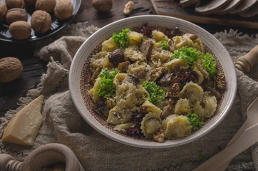 Homemade tortellini with mushrooms and walnuts