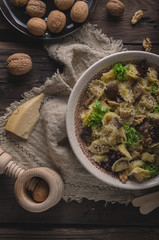 Homemade tortellini with mushrooms and walnuts