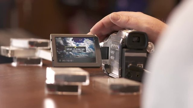 Indicator on LCD screen of digital Mini DV camcorder Use Cleaning Cassette displayed during recording/playback.