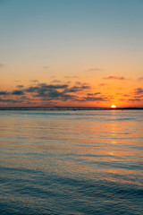 Sunset over the Robert Moses Causeway from Fire Island, New York
