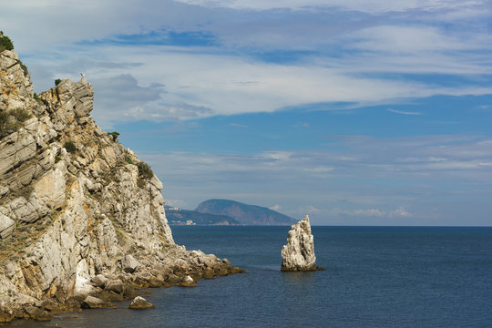 Fototapeta Rock Sail around the Cape Limen-Burun mountain in the background Iudah. Summer calm day on the Black sea