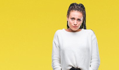 Young braided hair african american girl wearing winter sweater over isolated background depressed and worry for distress, crying angry and afraid. Sad expression.