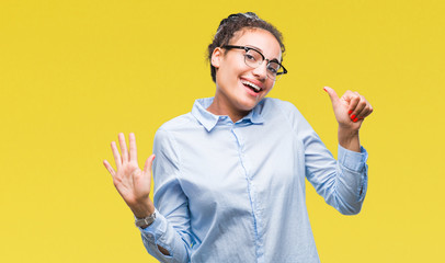 Young braided hair african american business girl wearing glasses over isolated background showing and pointing up with fingers number six while smiling confident and happy.