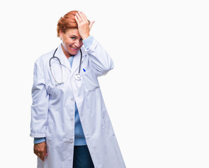 Senior caucasian doctor woman wearing medical uniform over isolated background surprised with hand on head for mistake, remember error. Forgot, bad memory concept.