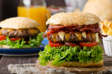 Homemade bacon burger with lettuce and cheddar