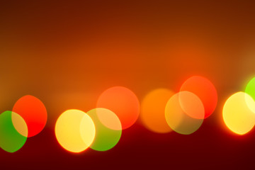 red orange background with blurred multicolored bokeh