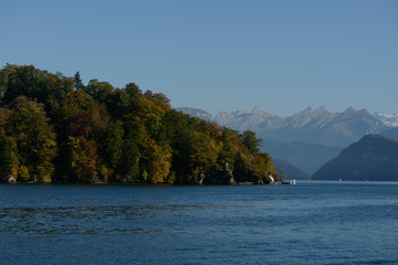 View from the lake on Jesus Christ Statue monument in Meggen, Luzern Lucerne, Switzerland. With background of  mountains