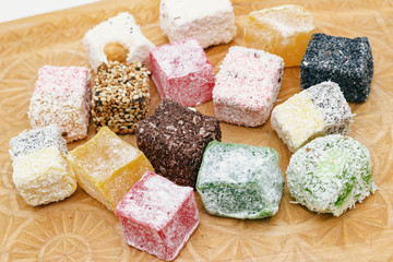 Dessert. Tasty Turkish delight on a wooden board