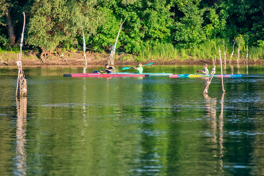 Novi Sad, Serbia - August 04, 2018: Danube island (&Scaron;odro&scaron;) near Novi Sad, Serbia. Man in kayak paddling on river.