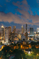 Fototapeta na wymiar Cityscape Bangkok skyline at night, Thailand. Bangkok is metropolis and favorite of tourists live at between modern building / skyscraper.