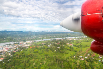 Air travel in Fiji, Melanesia, Oceania. View of Rewa river, Nausori town, Viti Levu island from a...