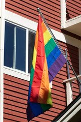 Rainbow Pride flags in front of a home