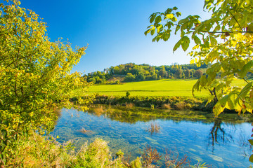 Fototapeta na wymiar Croatian nature, countryside landscape, river Dobra in autumn and old fortress in Novigrad, Karlovac county, Croatia 