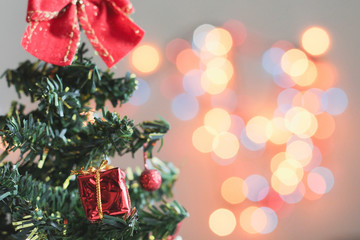 toy Christmas tree decorated with gifts, bokeh, background