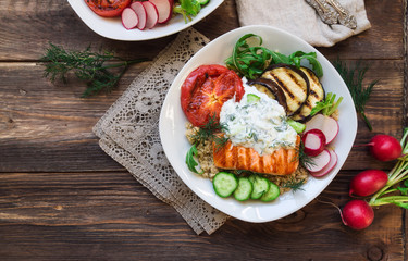 Grilled salmon, eggplants and tomatoes with quinoa and tzatziki sauce