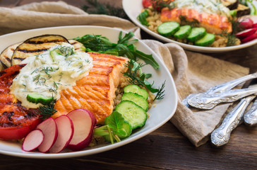 Grilled salmon, eggplants and tomatoes with quinoa and tzatziki sauce