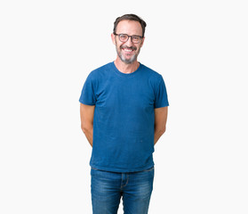 Obraz premium Handsome middle age hoary senior man wearin glasses over isolated background with a happy and cool smile on face. Lucky person.