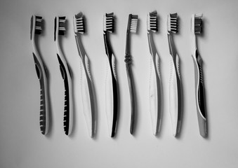 Close up shot of set of multicolored toothbrushes.