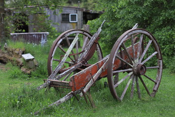 Old wooden wheelbarrow abandoned in a countryside