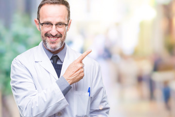 Middle age senior hoary professional man wearing white coat over isolated background cheerful with a smile of face pointing with hand and finger up to the side with happy and natural expression
