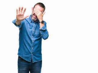 Middle age hoary senior man wearing glasses over isolated background covering eyes with hands and doing stop gesture with sad and fear expression. Embarrassed and negative concept.