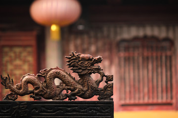 Detailed shot the dragon image on an incence container infront of the main hall of a buddhist temple in the old town of Suzhou city, China, Asia