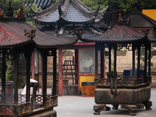 Various smoking incence containers for wishing and worshipping in a buddhist temple in the old town in Suzhou city, China, Asia