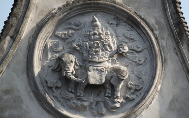 Stone carving showing an elephant on the gable of a traditional chinese building in an old town in...