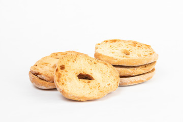Freselle or friselle, dried bread typical of the ancient tradition of southern Italy. The picture shows some slices with a central hole on a white background. Copyspace