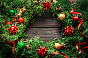 Fototapeta na wymiar Christmas handmade wreath on a wooden background.