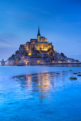 Lights of castle in twilight time in low tide in France