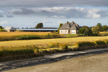 farm house on river side in sunny day in France © sergejson