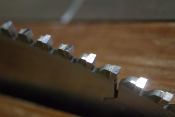 ends of points of disk saw on a circulation equipment..