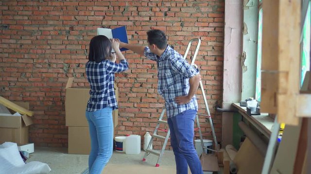 married couple, repairs in their home, choose interior design color palette