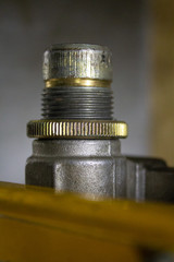 Screw-thread with a nut on the choke of tube of the lubricating system of machine-tool..