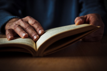 Hands and book