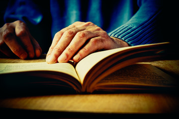 Hands and book