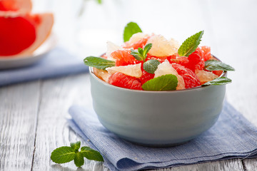 grapefruit plate on wooden background. Citrus diet