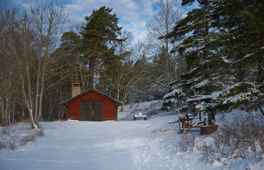 Old farm house at Lov&ouml; in Stockholm a snowy winter day