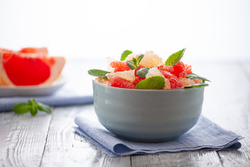 grapefruit plate on wooden background. Citrus diet