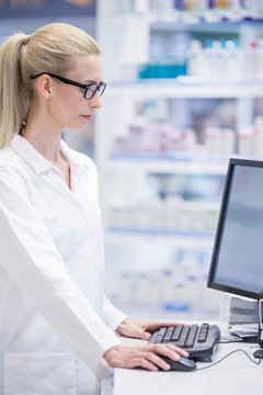 Pharmacist working on computer