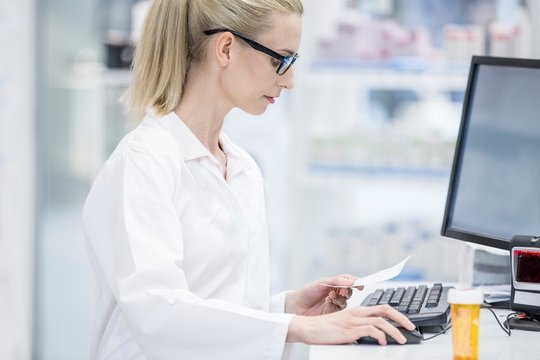 Pharmacist working on computer